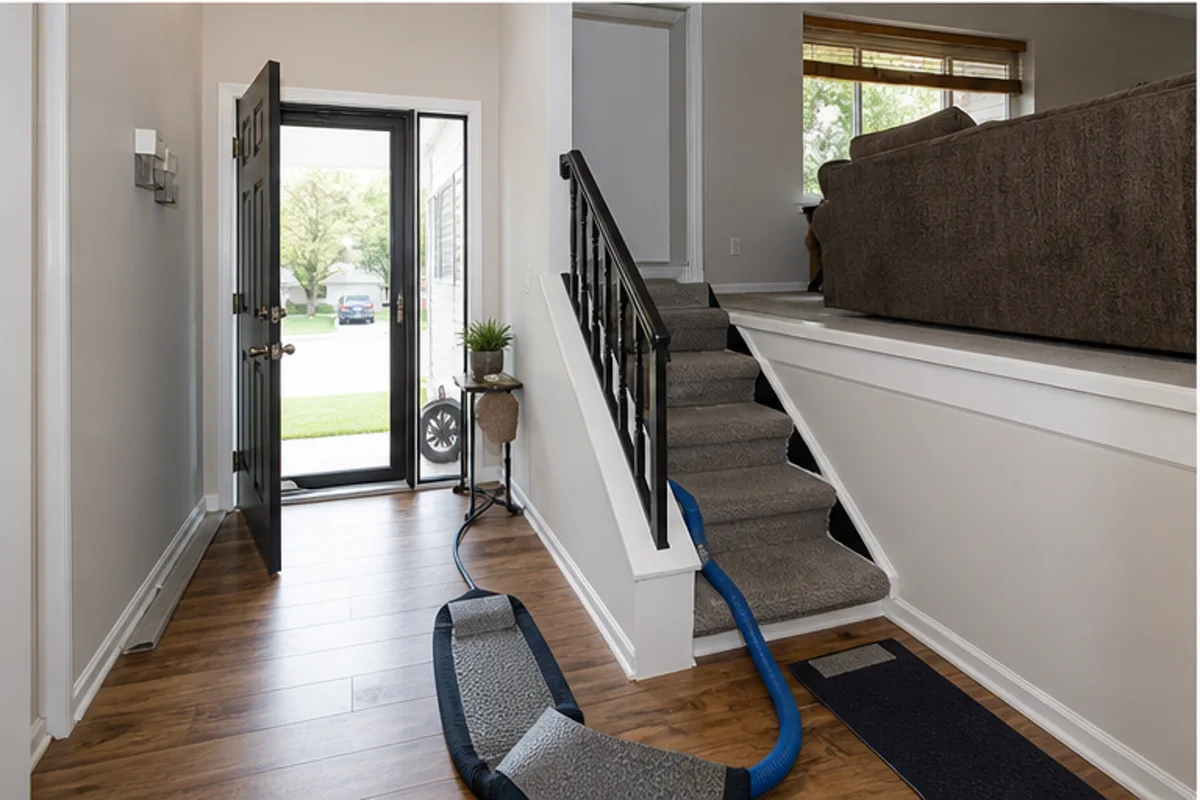 A Highland interior prepared with a clear access path for carpet cleaning